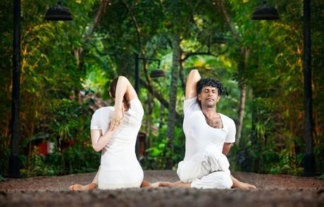 couple doing yoga in India