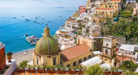 Enchanting Travels Italy Tours Beautiful Positano on hills leading down to coast - top 10 relaxing holiday destinations in europe