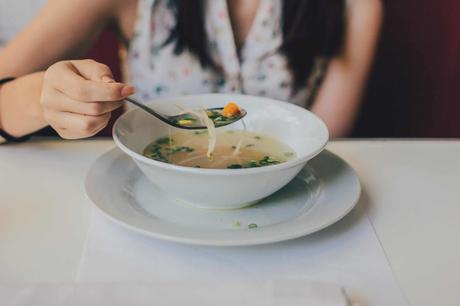 a bowl of vegetable soup with beansprouts in it