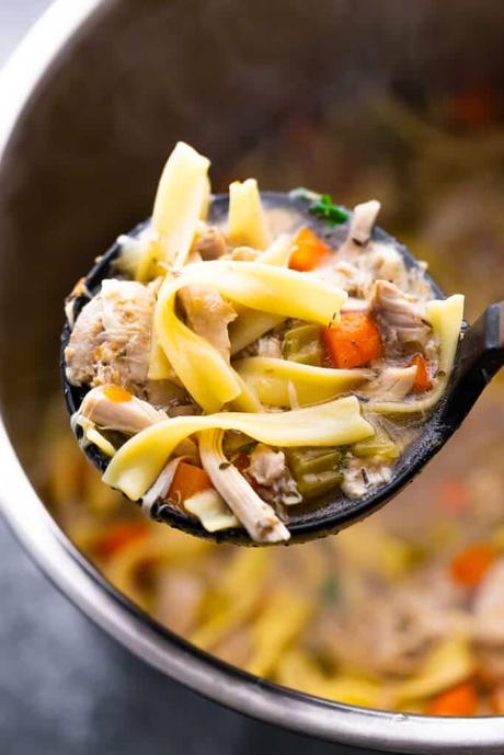 chicken noodle soup on a ladle over the instant pot