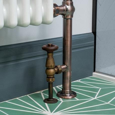 bronze radiator valves on a column towel rail