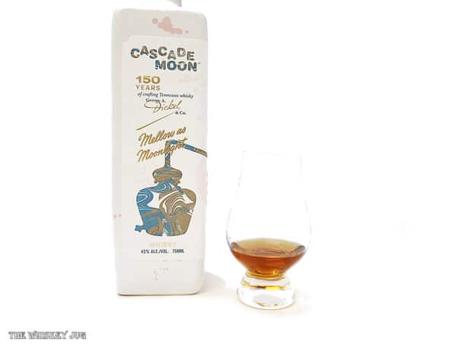 White background tasting shot with the Cascade Moon Edition 2 bottle and a glass of whiskey next to it.