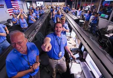 The Mars Science Laboratory (MSL) team in the MSL Mission Support Area cheer after learning the the Curiosity rover has landed safely on Mars, Sunday, Aug. 5, 2012 in Pasadena, Calif. 