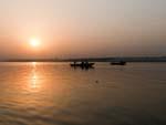 Early morning boats on the Ganges River at sunrise