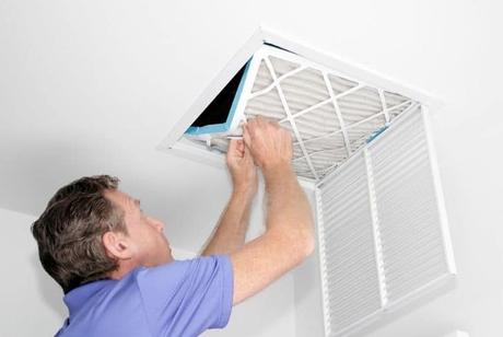 man-removing-dirty-air-filter