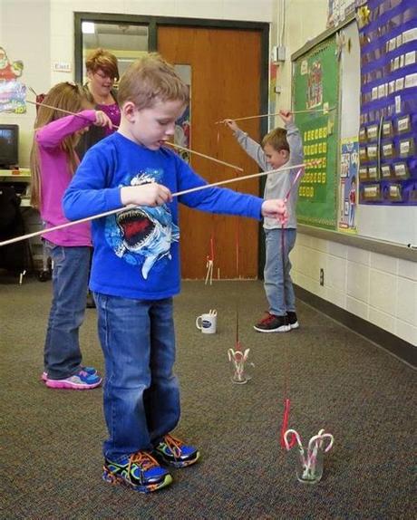 The player must use the candy cane hook to pick up the other candy canes and move them to the basket. Over 15 Christmas Party Games For Preschool Kids to Play ...