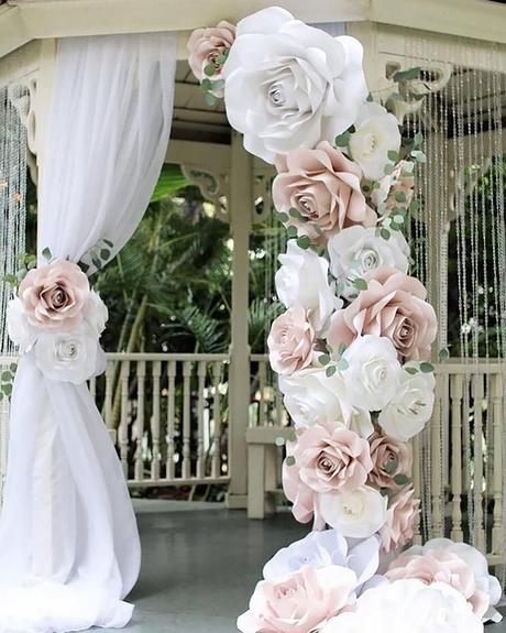 wedding decor trends bridal arch decorated with pink paper flowers vaniya gol via instagram