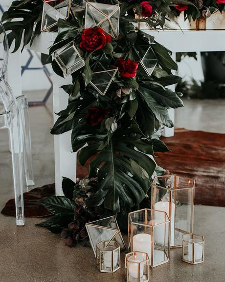 wedding decor trends table with greenery red flowers and geometric décor jessie schultz photography
