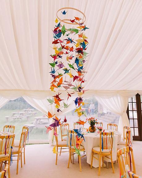 wedding decor trends reception under white tent decorated with bright origami pnm weddings