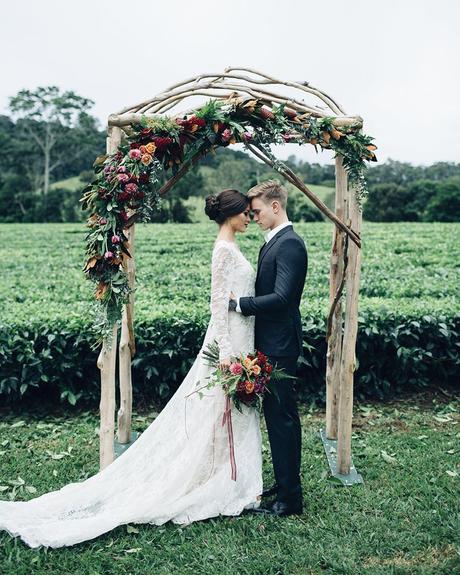wedding decor trends dark moodies flowers on woodland arch figtree pictures