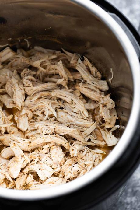 close up shot of shredded chicken in the instant pot