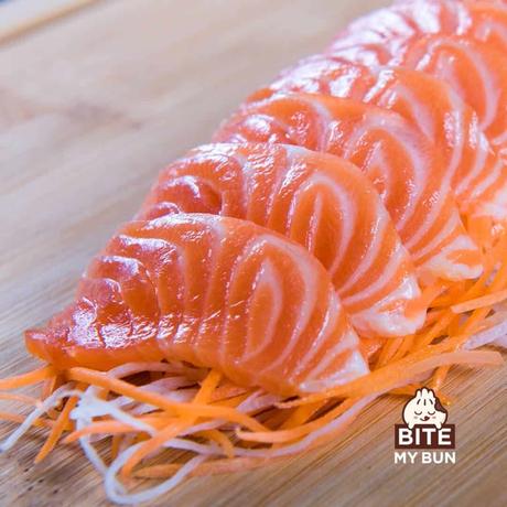 Salmon sashimi on a wooden cutboard