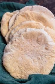 Nothing beats a freshly baked pitta bread. Easy Pita Bread Recipe How To Make Pita Bread The Mediterranean Dish