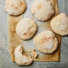 Pitta bread sandwiches are often substantial, meaty affairs, designed very much for the carniverous palate. Pitta Patter Yotam Ottolenghi S Recipes For Homemade Pitta With Chicken Skewers Or Herb Fritters Food The Guardian