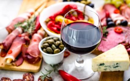 Enchanting Travels Spain Tours Traditional spanish tapas, wine snack set, food from spain, cheese, meat, vegetables and other appetizers on table