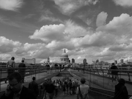 Black and white St Paul's Cathedral over the Millennium bridge.