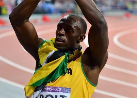 Usain Bolt celebrates after his 200 meter victory at London 2012