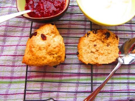 Buttermilk scones set out with jam and cream ready to serve