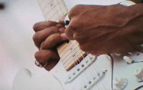 hendrix playing guitar at woodstock