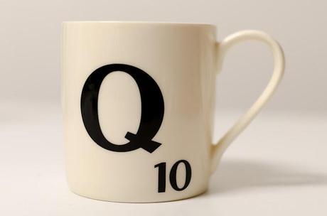 scrabble mug with the letter q written on it