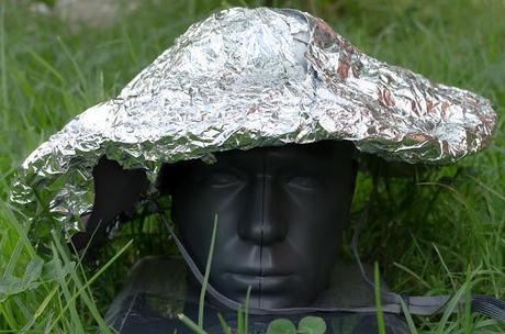 alfoil over sun hat on top of plastic head