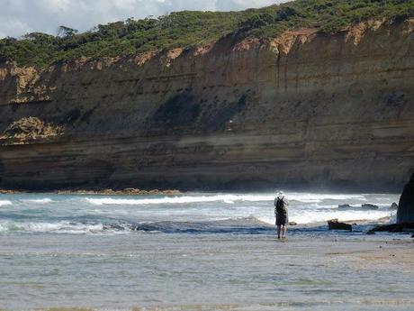 man in water near jan juc cliffs