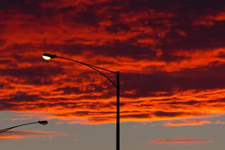 red sunrise and street light