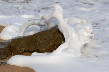 waves over rock on beach