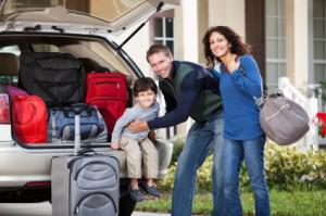 luggage family 300x199 5 Tips to Save Money on Travel this Summer