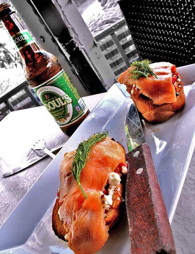 smoked salmon bruschetta with goat cheese and non alcoholic beer 