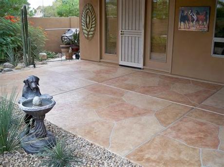 The patio flooring is stamped concrete, while the fire pit and outdoor kitchen is created from the flooring is new york bluestone. Cheap patio flooring ideas - theradmommy.com