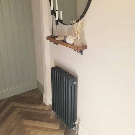 anthracite column radiator in a boot room