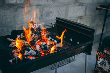 flaming charcoal on black grill