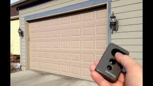 To lock it, push out the sliding bolt. How To Lock A Garage Door Opener Remote Youtube