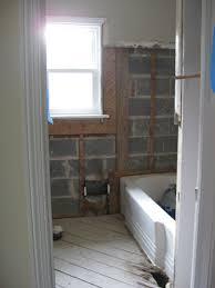 Floors, walls, showers, and tubs. Demoing Tile Mortar Metal Mesh In The Bathroom Walls Young House Love