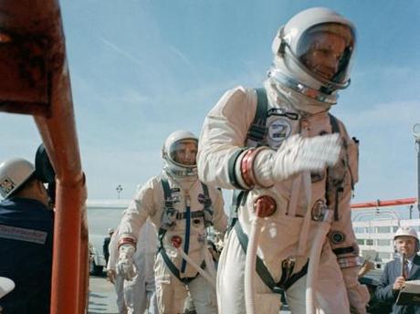 Commander Neil Armstrong (right) and pilot David R. Scott prepare to board the Gemini-Tita...