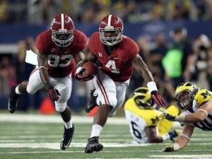 T.J. Yeldon #4 of the Alabama Crimson Tide runs the ball against Jake Ryan #90 of the Michigan Wolverines at Cowboys Stadium on September 1, 2012 in Arlington, Texas. (Photo by Ronald Martinez/Getty Images)
