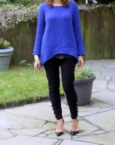 The brocade trousers and the royal blue sweater