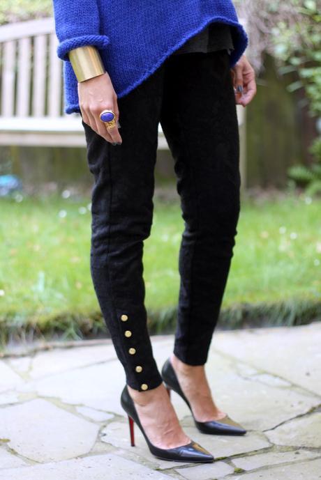 The brocade trousers and the royal blue sweater