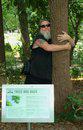 K hugs tree in The Gardens by J Joan