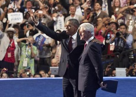 Barack Obama embraces Bill Clinton after Clinton's DNC speech.