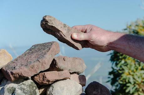 placing rock on durd-durd summit cairn