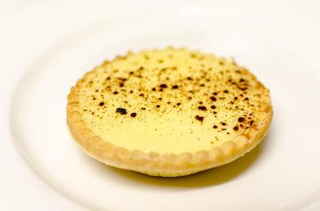 custard tart on white plate