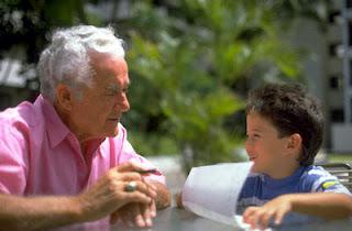 Grandson playing with his grandfather