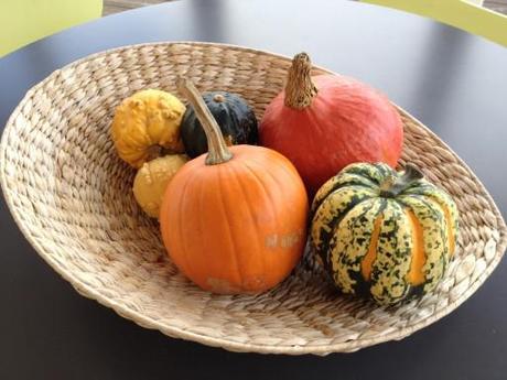 gourds arranged in wicker bowl