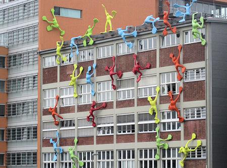 Giant Sticky Man Toys Climb German Buildings