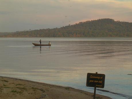 A fisherman passes the beach at Munyonyo, Lake Victoria - why I love Uganda