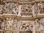 A monkey text to some erotic sculptures at the Vishwanath Temple