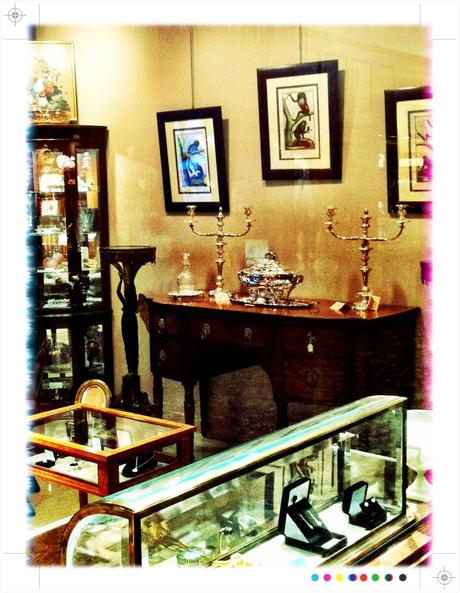 an antique store, filled with exquisite silver candelabra and diamond rings