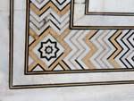 Intricate decorative borders from coloured stone inlays